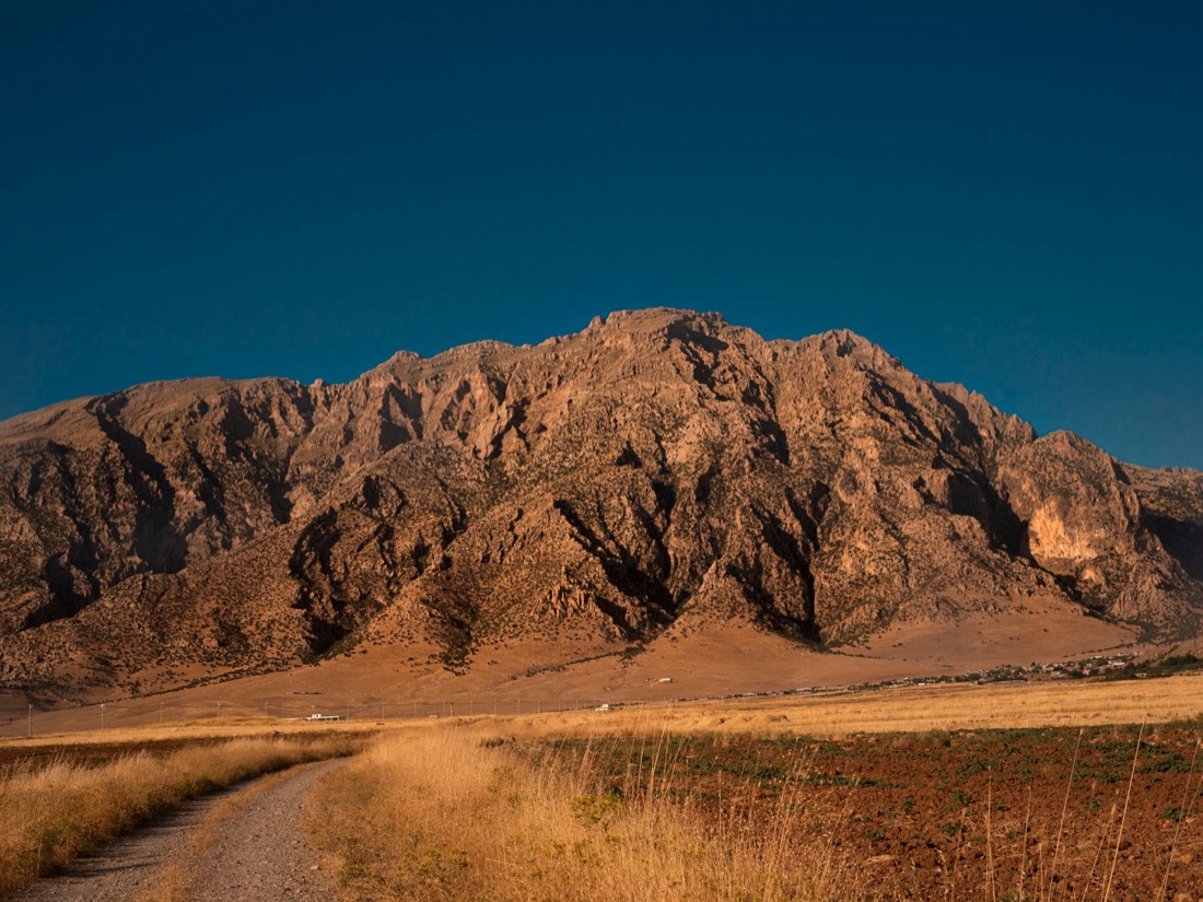 The mountains near Duhok lit gold in the evening light